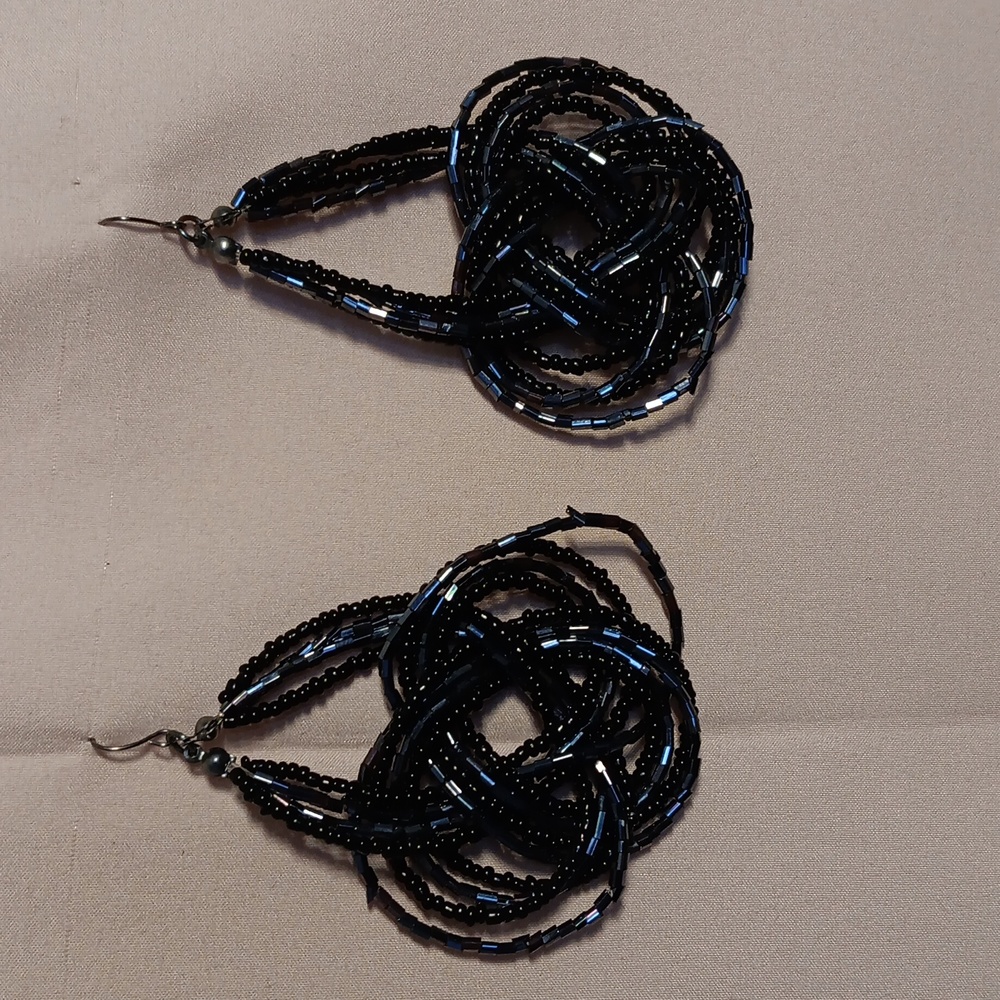 Women's black bangled earrings